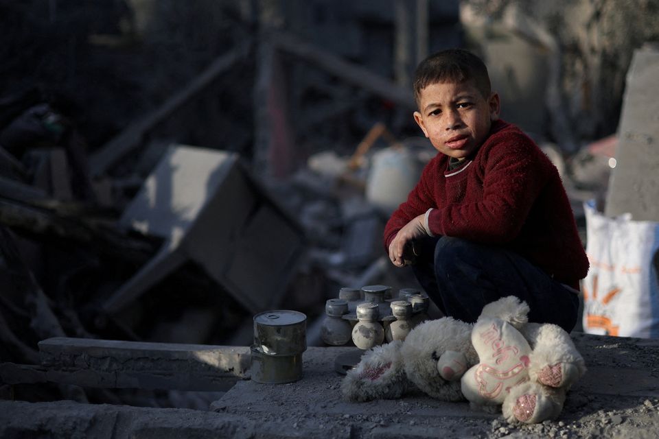 A Palestinian child looks on, at the site of an Israeli strike on a house, amid the ongoing conflict between Israel and the Palestinian Islamist group Hamas, in Rafah in the southern Gaza Strip, February 12, 2024. REUTERS/Ibraheem Abu Mustafa     TPX IMAGES OF THE DAY     