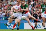 thumbnail: Tyrone's Peter Harte and Tom Cunniffe clash shoulder to shoulder