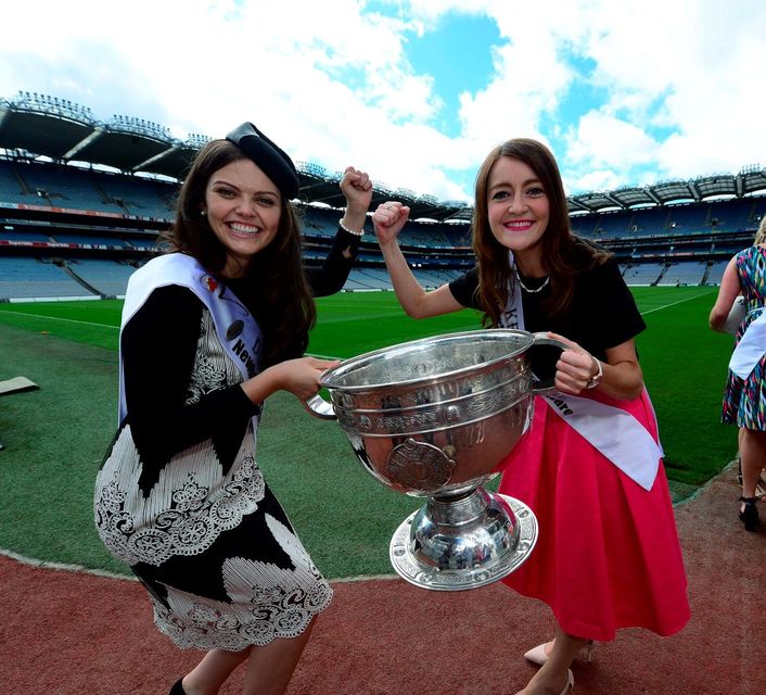 Dublin Rose Aisling Finnegan and Kerry Rose Julett Culloty do battle over the Sam Maguire cup during a visit to Croke Park. Photo: Domnick Walsh