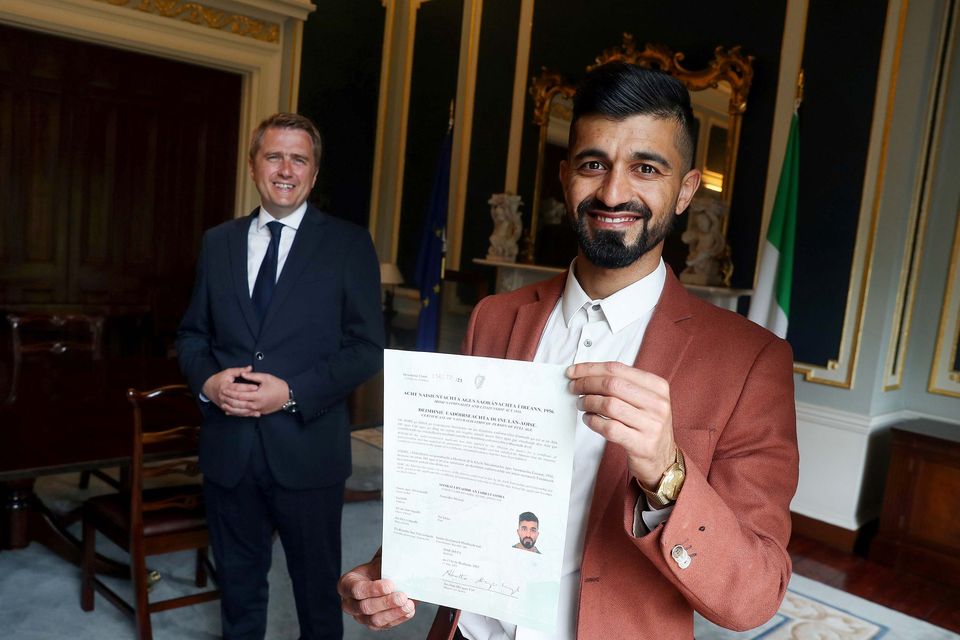 Minister of State for Law Reform, Youth Justice and Immigration, James Browne TD and Zak Moradi, new Irish citizen.