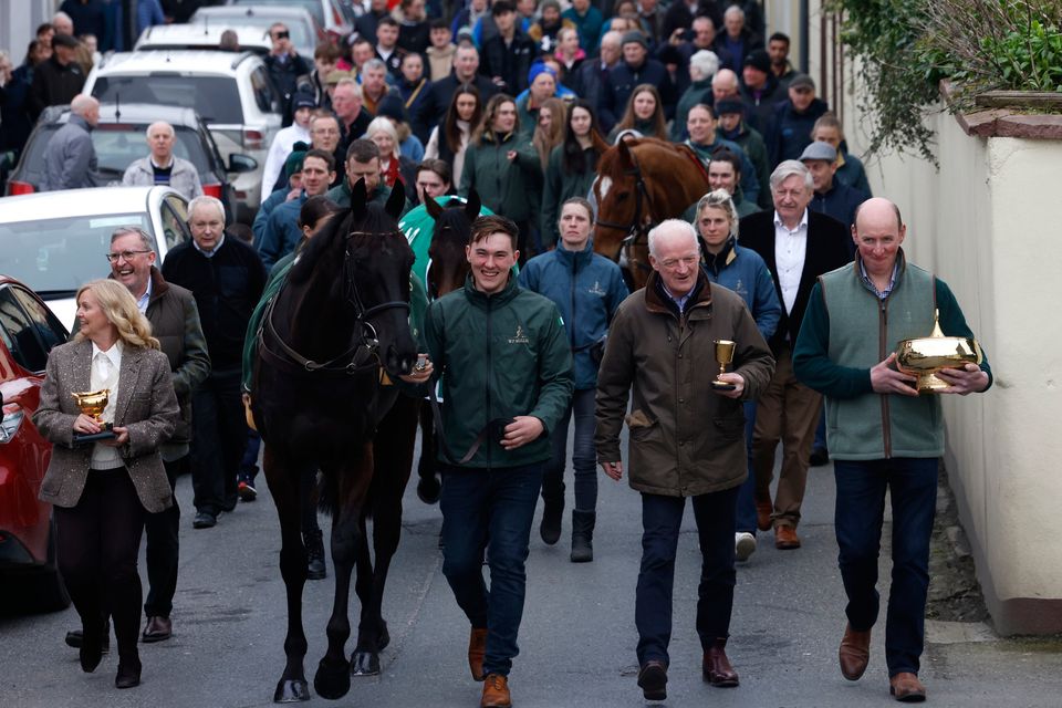 Owner Audrey Turley, 2024 Boodles Cheltenham Gold Cup winner Galopin Des Champs, groom Adam Connolly, and trainer Willie Mullins (left-right) lead the parade