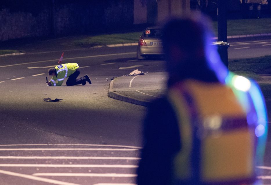Gardai examine the scene where two women were hit and seriously injured by a car