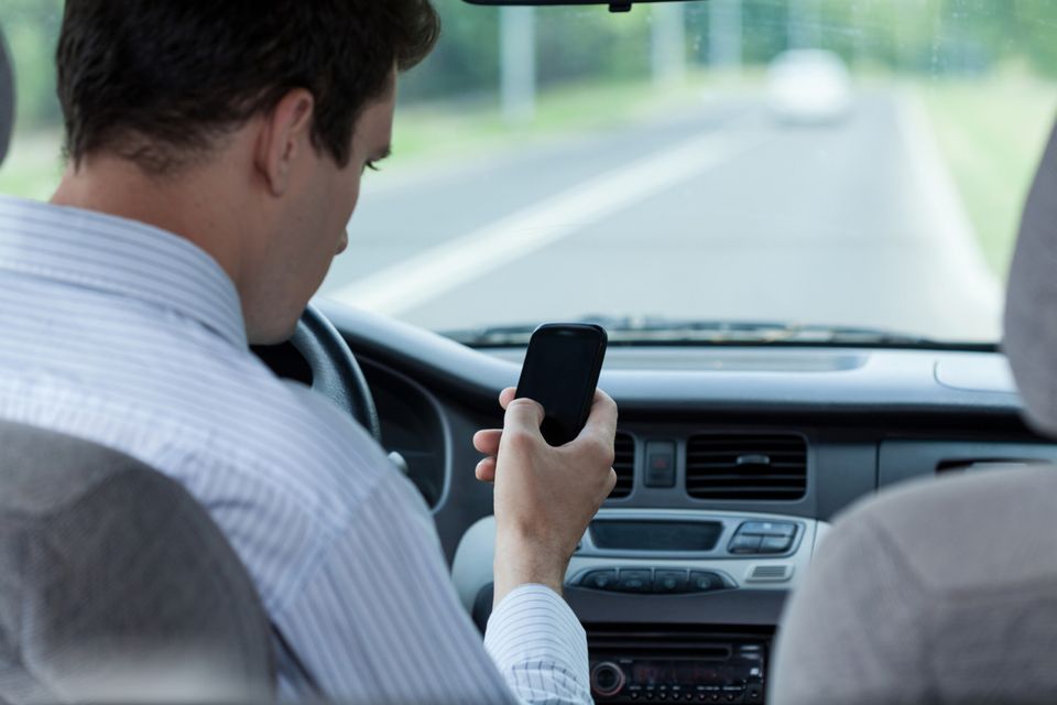 Block mobile phones in cars rather than hike penalties new survey