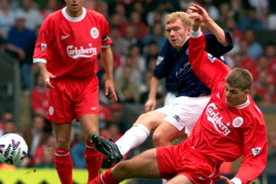 File photo dated 11/9/99 of  Manchester United's Paul Scholes is tackled by Liverpool's Steven Gerrard during  Premiership match at Anfield. PRESS ASSOCIATION Photo. Issue date: Friday May 15, 2015. Steven Gerrard season by season. See PA story SOCCER Season by Season. Photo credit should read PHIL NOBLE/PA Wire.