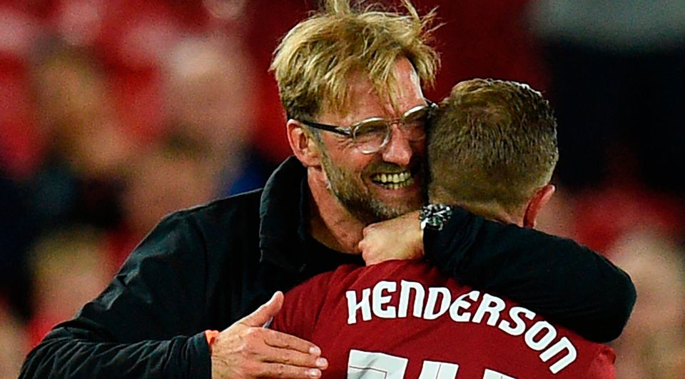 Liverpool's German manager Jurgen Klopp (L) celebrates victory with Liverpool's English captain Jordan Henderson. Photo: Getty Images