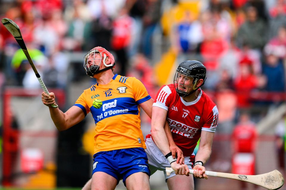 Peter Duggan of Clare is tackled by Damien Cahalane of Cork