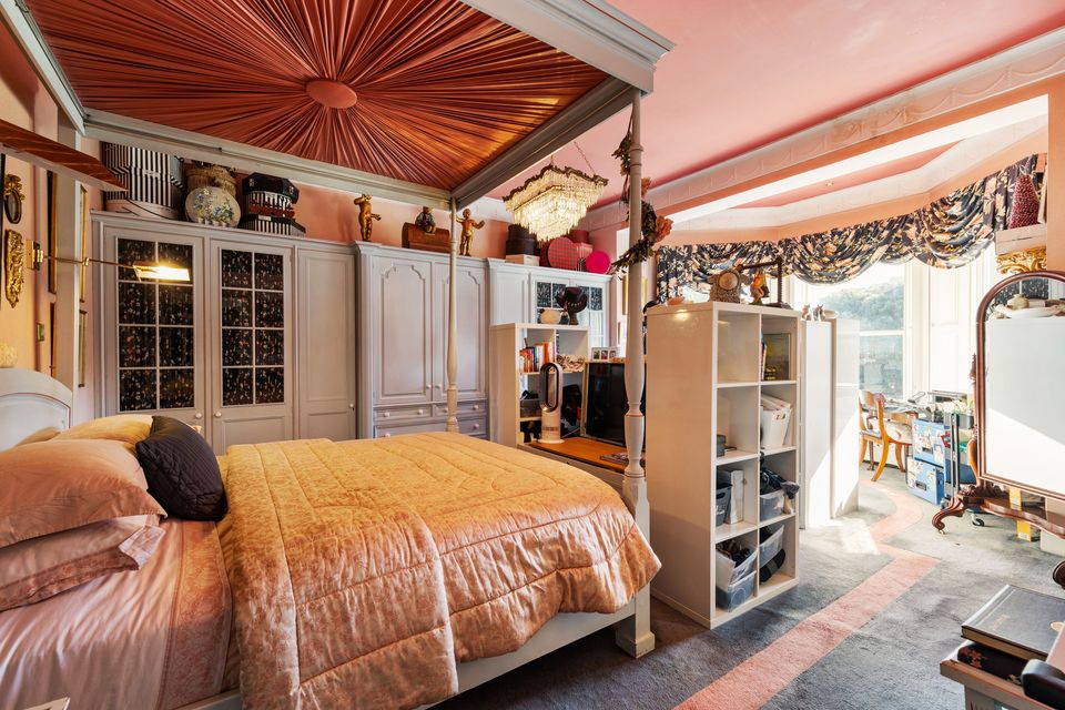 One of the bedrooms with a classic four-poster bed