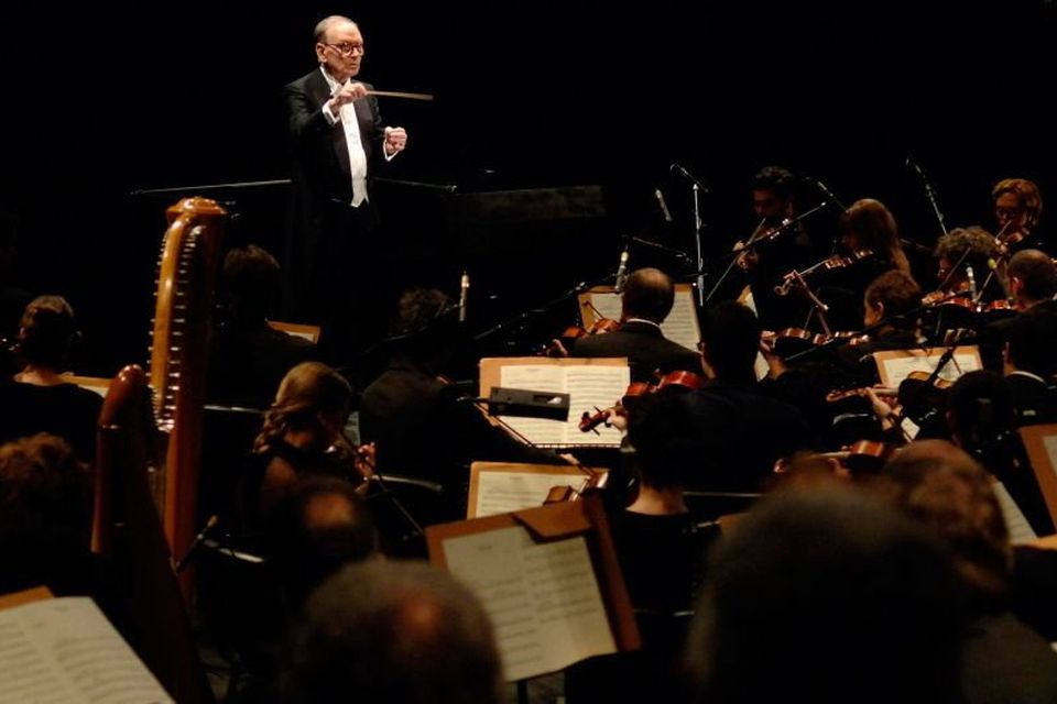 The late composer Ennio Morricone in concert at the Hammersmith Apollo in west London in 2006. Photo credit: Yui Mok/PA Wire