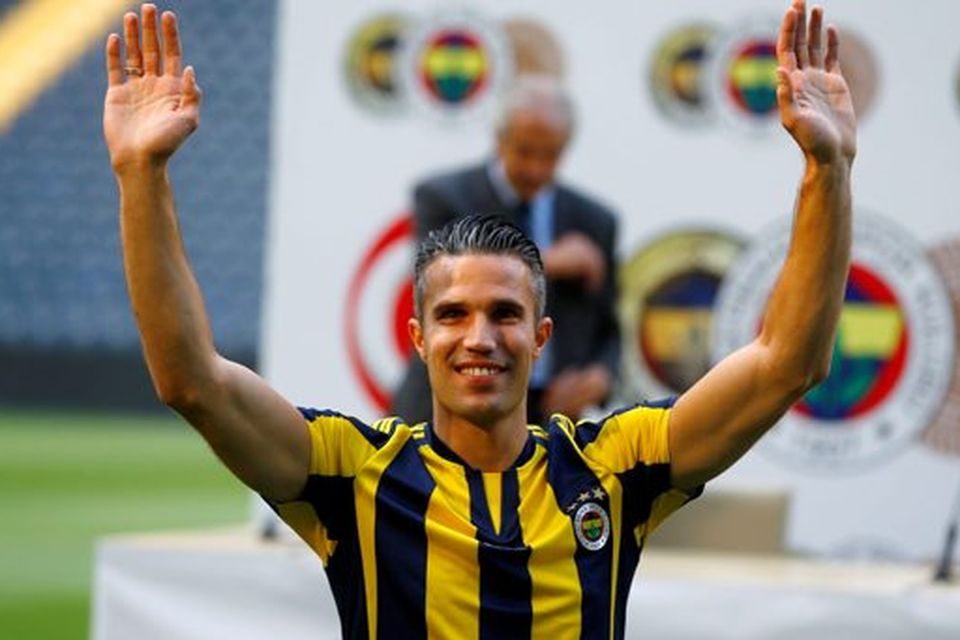Robin van Persie greets supporters during his contract-signing ceremony with Turkish club Fenerbahce