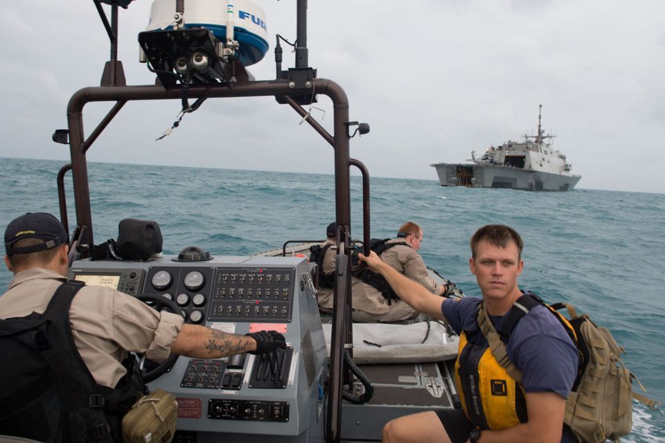 Sailors from the US Navy's USS Fort Worth searching in the Java Sea for  AirAsia Flight QZ8501