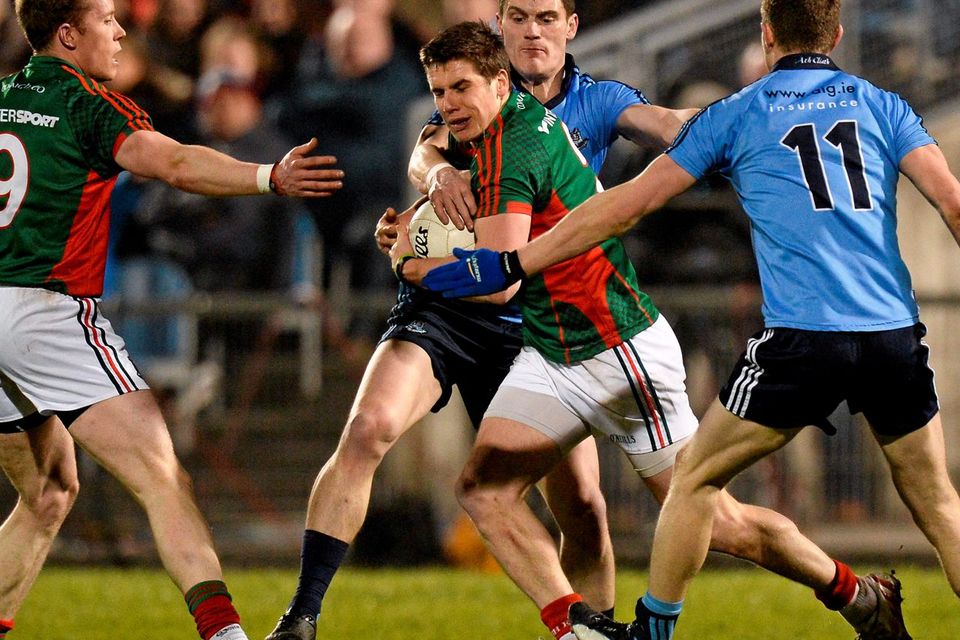 Lee Keegan, Mayo, supported by team-mate Donal Vaughan, 9, in action against Diarmuid Connolly and Dean Rock,11, Dublin