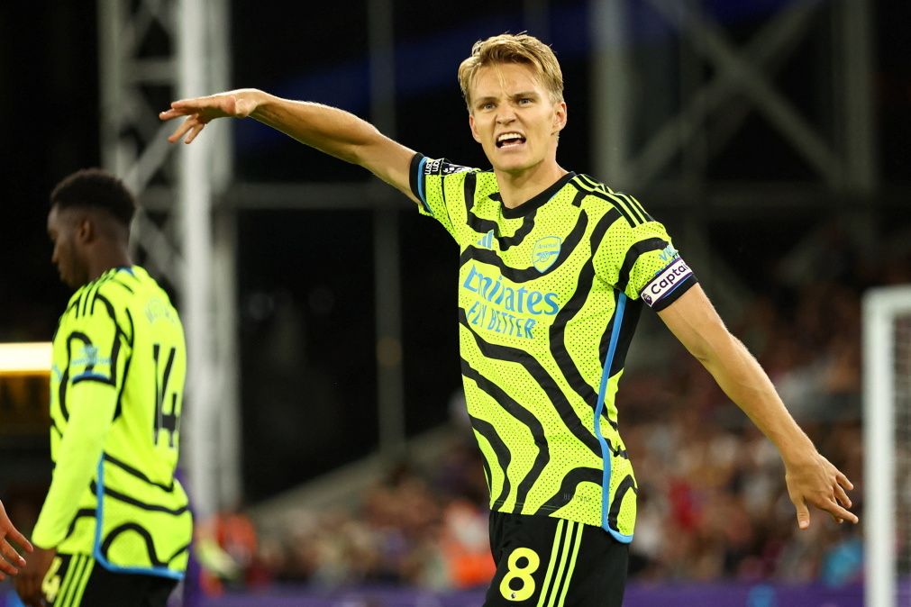 Martin Odegaard's penalty seals a nervy win for 10-man Arsenal