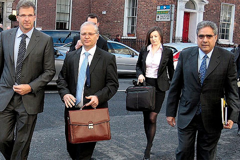 The IMF's Ajai Chopra, right, accompanied by by Istvan Szekely of the European Commission, centre, and Klaus Masuch, left the ECB' s chief economist and other troika officials arriving at the Department of Finance