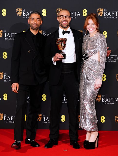 Cord Jefferson with Kingsley Ben-Adir and Bryce Dallas Howard after American Fiction won the best adapted screenplay award at the Baftas (Ian West/PA)
