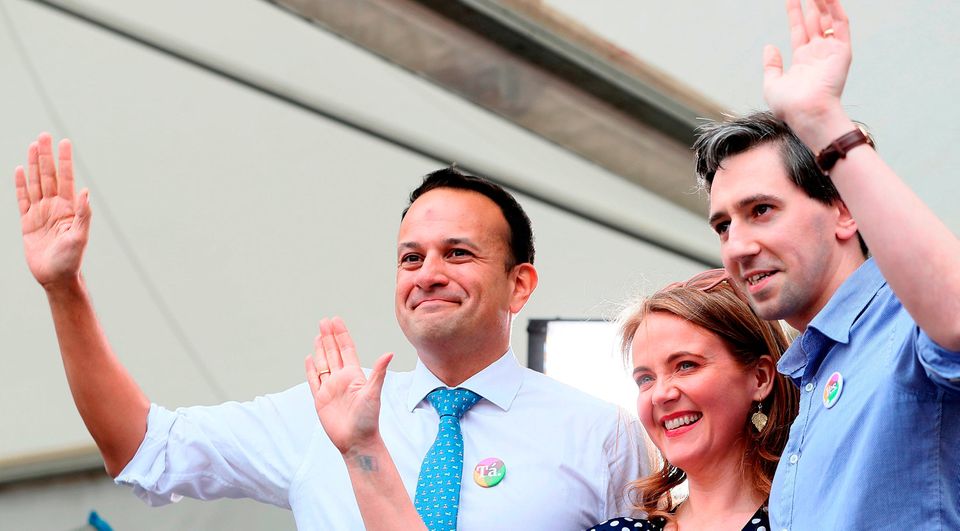 An Taoiseach Leo Varadkar (left), Minister for Health Simon Harris and Senator Catherine Noone wave to the crowd at Dublin Castle. Photo: Brian Lawless/PA Wire