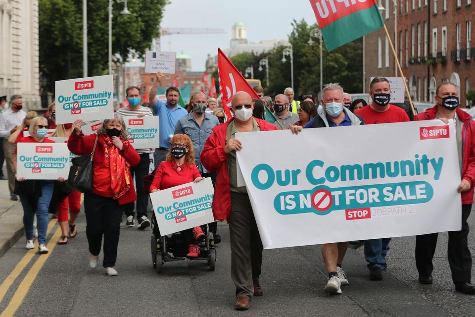 Members of the trade union SIPTU protest against the government’s Job Path scheme outside the Government Buildings in Dublin (Niall Carson/PA)