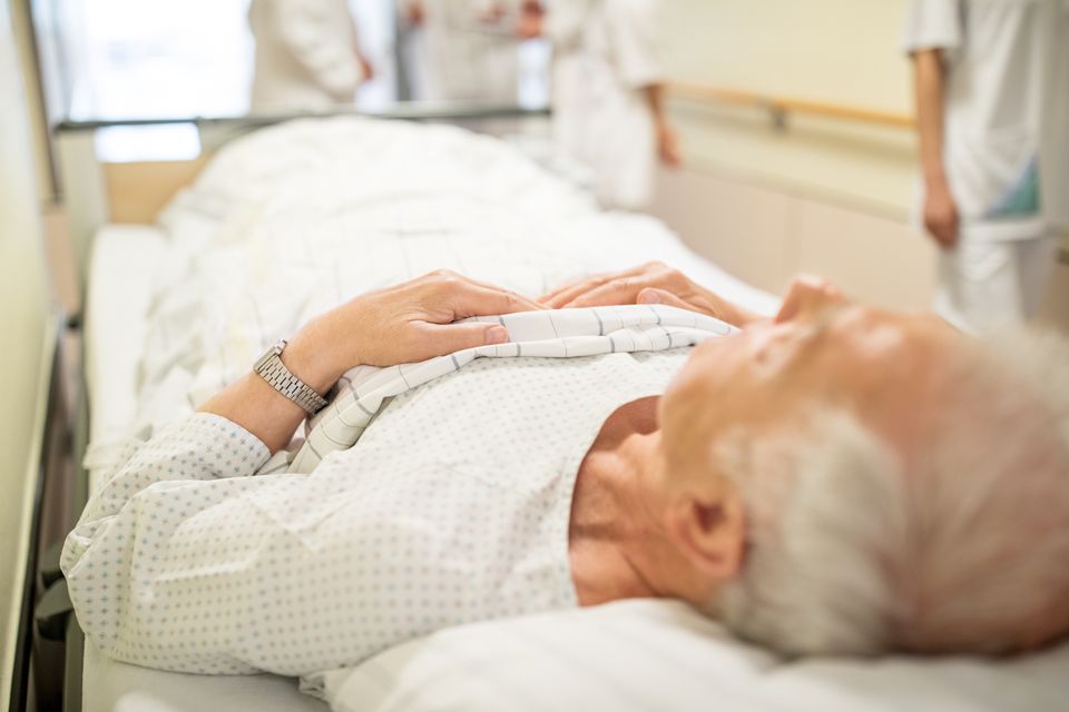 Elderly man on hospital trolley. Stock photo: Getty