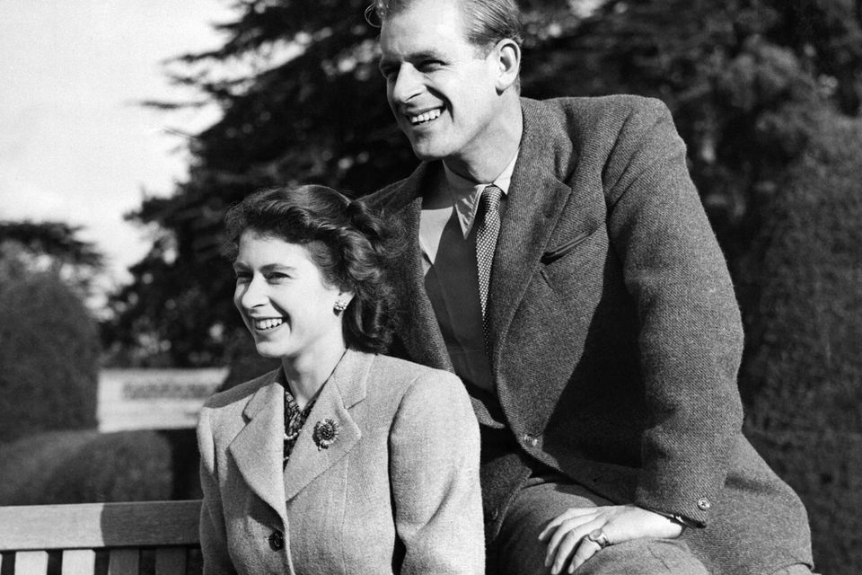 Britain's Princess Elizabeth (future Queen Elizabeth II) and her husband Philip, Duke of Edinburgh, pose during their honeymoon, November 25, 1947 in Broadlands estate, Hampshire. (Photo by - / - / AFP)        (Photo credit should read -/AFP/Getty Images)