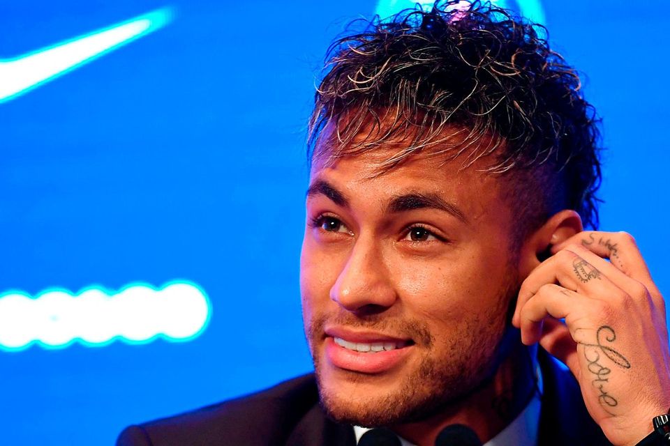 Brazilian superstar Neymar listens during a press conference at the Parc des Princes stadium