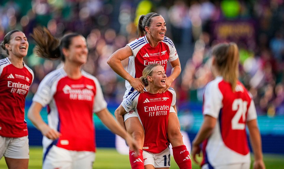 Katie McCabe of Arsenal, centre top, celebrates with team-mate Leah Williamson after their Women's Champions League final win over Barcelona at Estádio José Alvalade in Lisbon, Portugal. Photo: Pedro Loureiro/Sportsfile