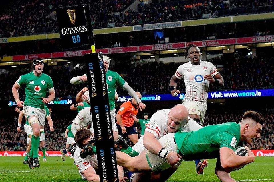 Alcohol ads on the pitch as Dan Sheehan scores try during the Six Nations match against England at the Aviva Stadium. Photo: Seb Daly/Sportsfile