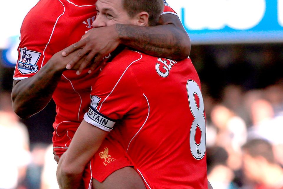 File photo dated 19-10-2014 of Liverpool's Raheem Sterling  with his team-mate Steven Gerrard.
Nick Potts/PA Wire.