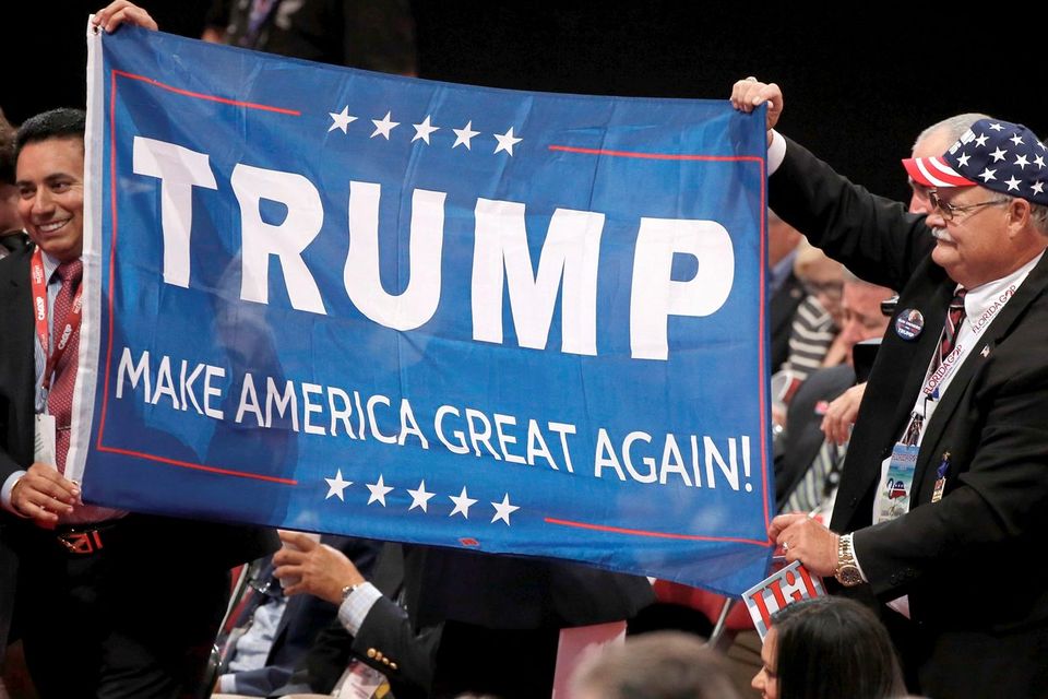 Delegates parade a Donald Trump banner around the floor at the Republican National Convention in Cleveland, Ohio. Picture Credit: REUTERS/Mike Segar