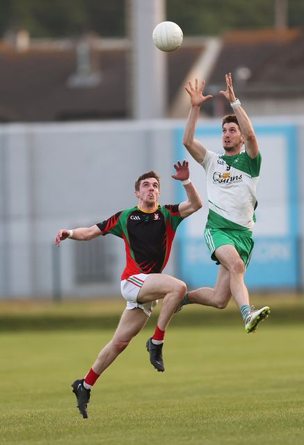 Pat Burke of Baltinglass reaches this ball ahead of Kiltegan's Liam Keogh. 