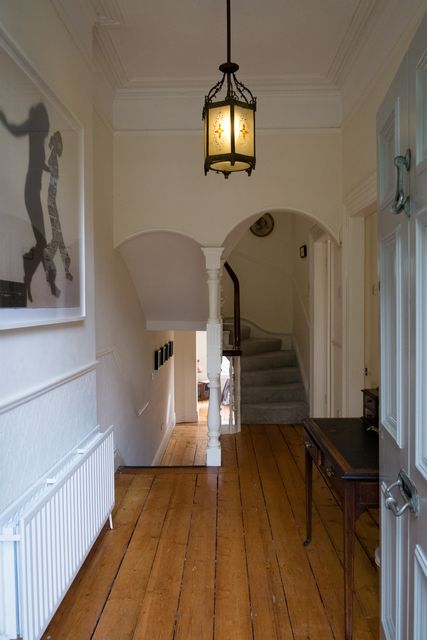 The entrance hall also features original wooden floors