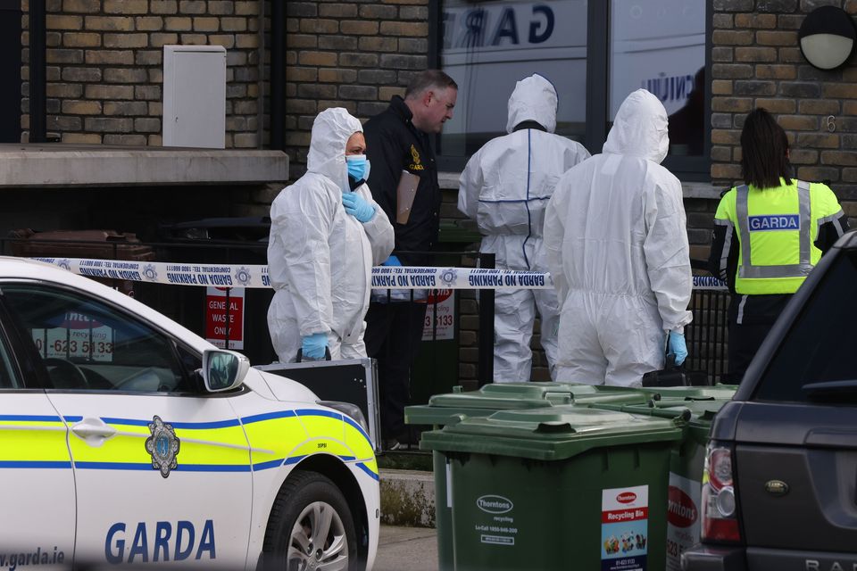 Gardaí and forensics team members at the house where the body was found. (Photo: Eamonn Farrell/© RollingNews.ie)