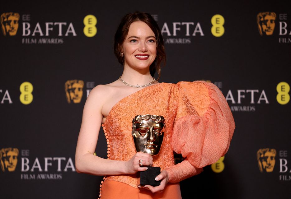 Emma Stone poses in the winner's room with her award for Leading Actress for "Poor Things" during the 2024 British Academy of Film and Television Awards (BAFTA) at the Royal Festival Hall in the Southbank Centre, London, Britain,  February 18, 2024. REUTERS/Hollie Adams