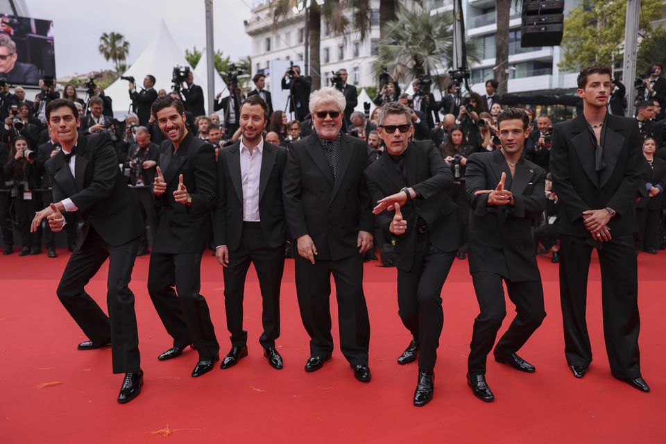 From left: George Steane, Jose Condessa, producer Anthony Vaccarello, director Pedro Almodovar, Ethan Hawke, Jason Fernandez and Manu Rios pose for photographers after arriving for the premiere of the film Monster at the 76th Cannes Film Festival in southern France (Vianney Le Caer/Invision/AP)