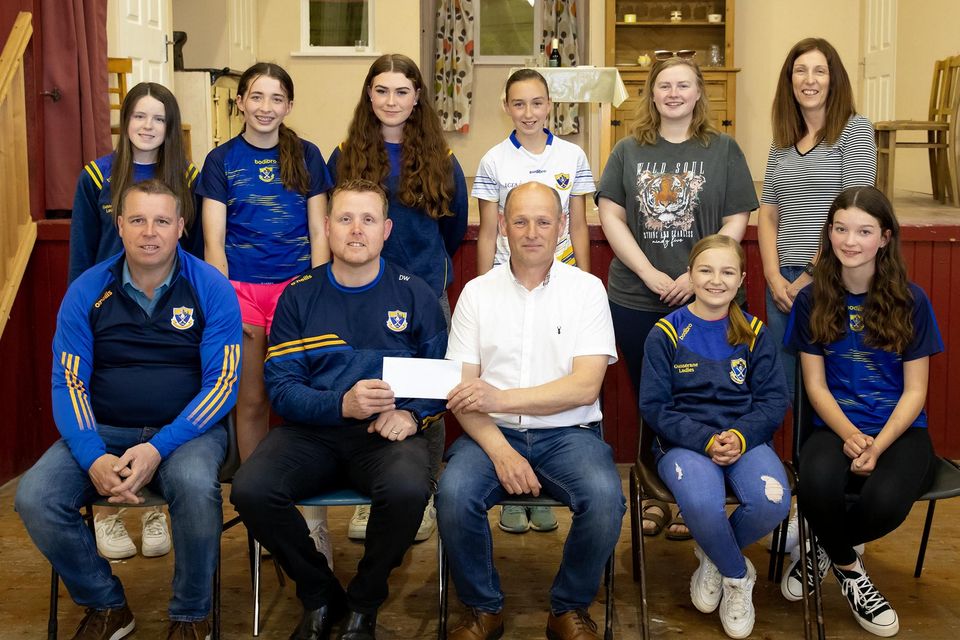 Harry Twomey from Tintern Drama group presents €1800 to David Wall chairperson of Gusserane camogie club who are heading to regional finals in June. The money was raised at their recent performance in Gusserane hall. Photo; Mary Browne 