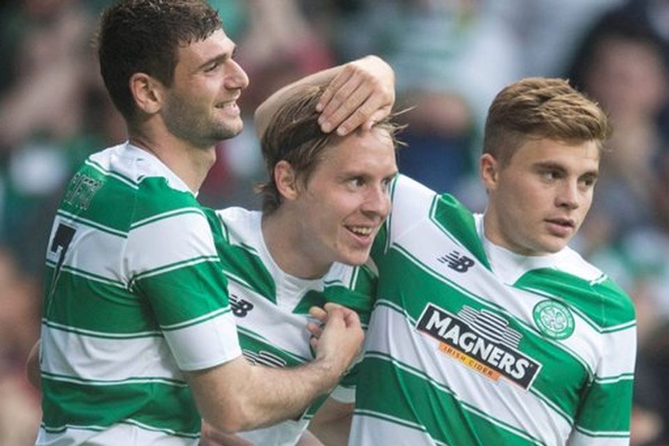 Celtic's Stefan Johansen (centre) celebrates scoring his side's second goal with Nadir Ciftci (left) and James Forrest during the UEFA Champions League Second Qualifying Round, First Leg, at Celtic Park