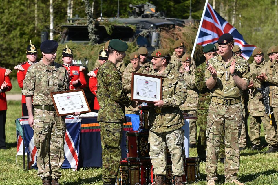 Prince Harry (centre right) clapping as members of the Estonia army are awarded commendations on behalf of Brigadier James Woodham at a military exercise in Sangaste