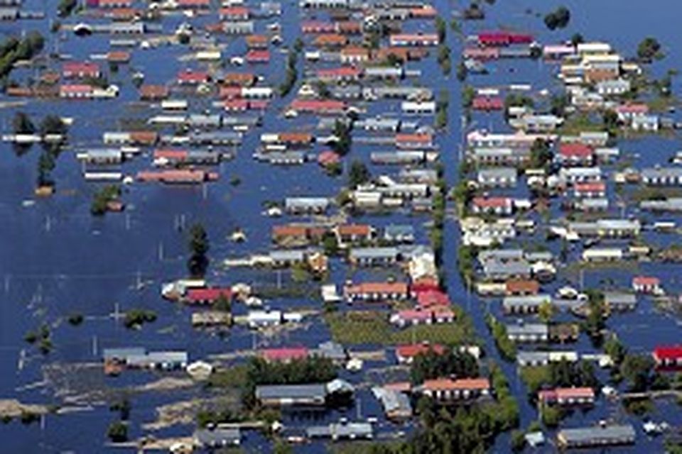 Heavy flooding in the extreme south and north-east of China has left more than 200 dead or missing in recent days (AP)