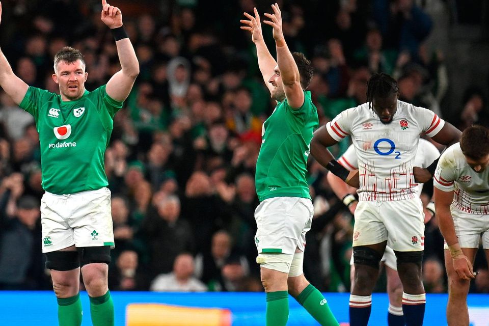 Peter O'Mahony and Jack Conan of Ireland celebrate at the full-time whistle as Maro Itoje and Henry Slade of England react after the Guinness Six Nations Rugby Championship match between Ireland and England at the Aviva Stadium in Dublin.