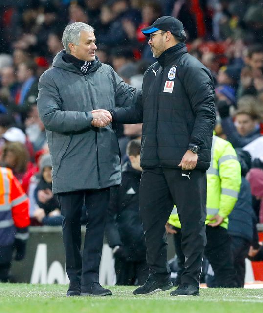 David Wagner, right, shakes hands with Mourinho after the game