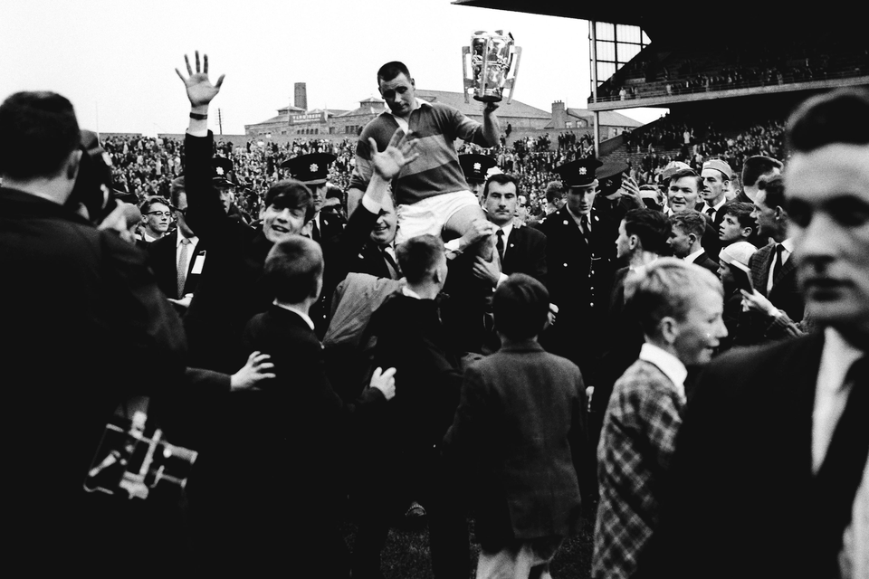 Jimmy Doyle holds the Liam MacCarthy Cup as he is held aloft by Tipperary supporters after his side’s vitory over Wexford in 1965