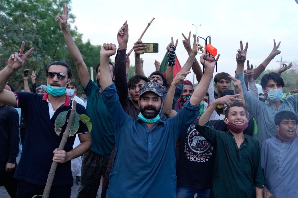 Supporters of Imran Khan celebrate after Lahore's Supreme Court ordered the release of Khan. Photo: K.M. Chaudary / AP Photo