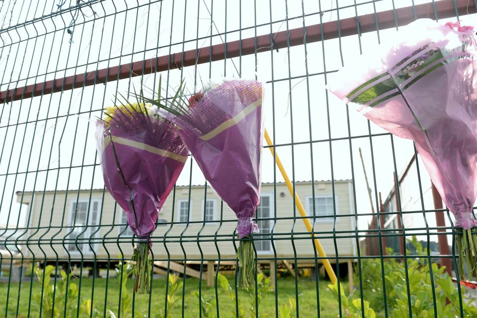 Tributes at the scene in Clogerhead, Co Louth, where Keith Branigan was shot dead
