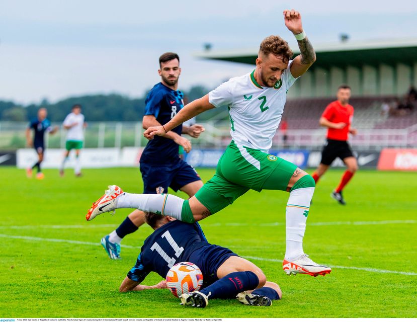 Ireland's Sam Curtis is tackled by Niko Kristian Sigur of Croatia 