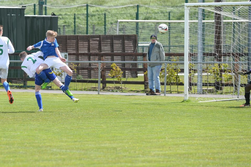 19/05/15. Glenn Hollywood gets his shot away during the Under 15s soccer final between Colaiste Phadraig CBS and Templeouge College at Peamount Utd.
Pic: Justin Farrelly.