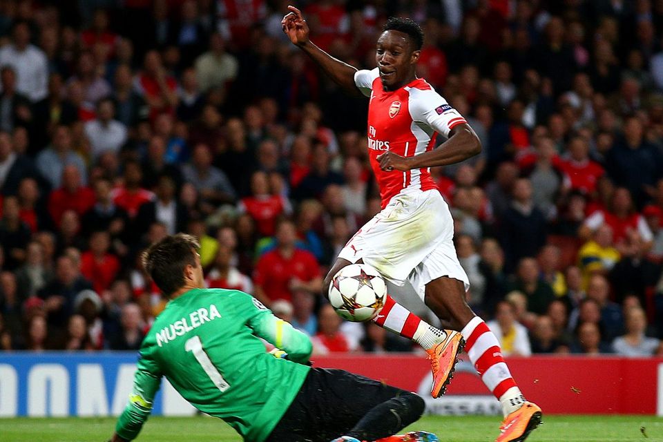 Danny Welbeck lifts his shot over Fernando Muslera to score his third goal and Arsenal's fourth in their Champions League game against Galatasaray at the Emirates. Photo: Paul Gilham/Getty Images