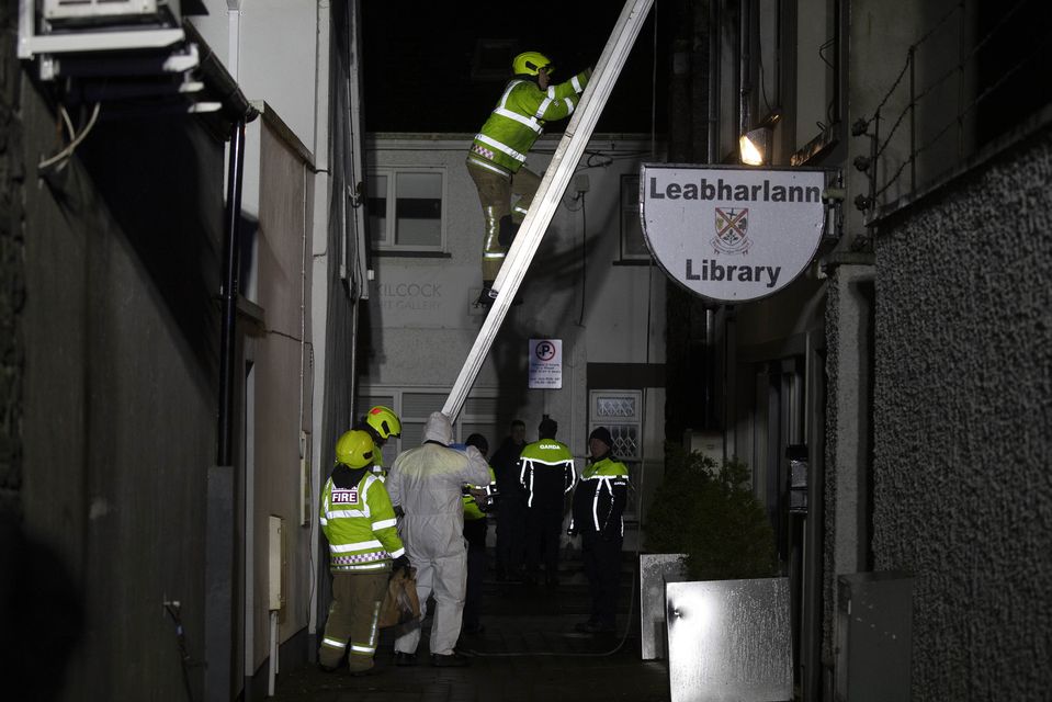 Gardaí and firefighters pictured on the balcony of an apartment at the scene of a fatal incident on School Street, Kilcock, County Kildare. Picture: Colin Keegan, Collins Dublin