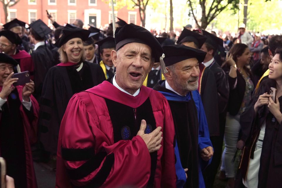 Actor Tom Hanks greets radical   arsenic  helium  walks successful  a procession though   Harvard Yard (Steven Senne/AP)