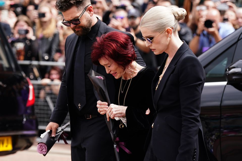 Jack, Sharon and Kelly Osbourne viewed messages left at the Black Sabbath Bridge bench in Birmingham (Jacob King/PA)