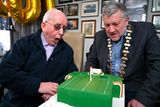 thumbnail: 1 February 2024; FAI president Paul Cooke presents a birthday cake to former kit man, referee and legislator, Charlie O'Leary on the occasion of his 100th birthday. Photo by Ray McManus/Sportsfile 