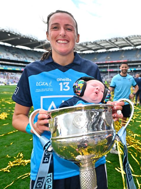 Dublin's Hannah Tyrrell and her seven-week old daughter Aoife celebrate with the Brendan Martin Cup. Photo: Seb Daly/Sportsfile