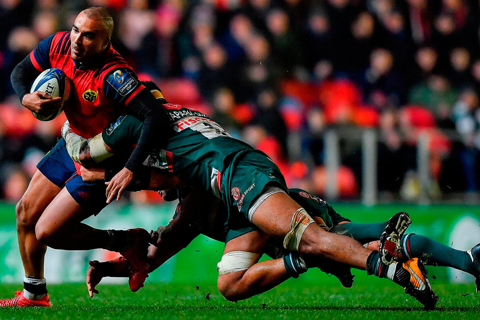 Munster’s Simon Zebo is tackled by Valentino Mapapalangi and Mike Williams of Leicester Photo: Brendan Moran/Sportsfile